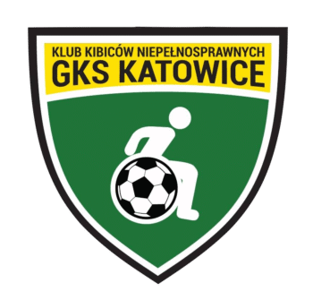 Logo w kształcie tarczy z zielonym tłem i białą obwódką. Na górze znajduje się żółty pas z czarnym napisem: „KLUB KIBICÓW NIEPEŁNOSPRAWNYCH GKS KATOWICE”. Poniżej tekstu widnieje biały zarys postaci na wózku inwalidzkim, z piłką wkomponowaną w konstrukcję wózka.